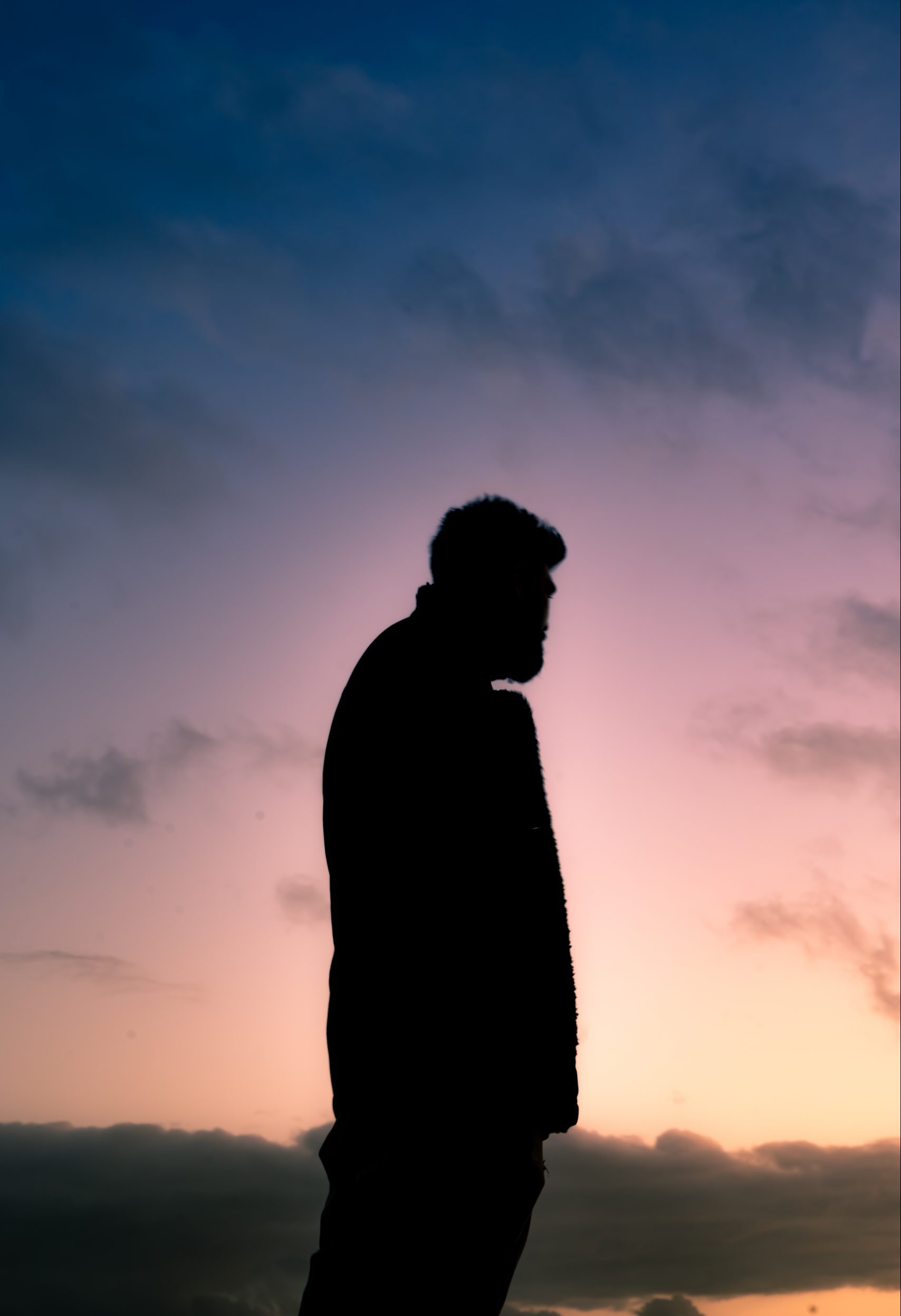 Silhouette of a Man in Front of a Sunset