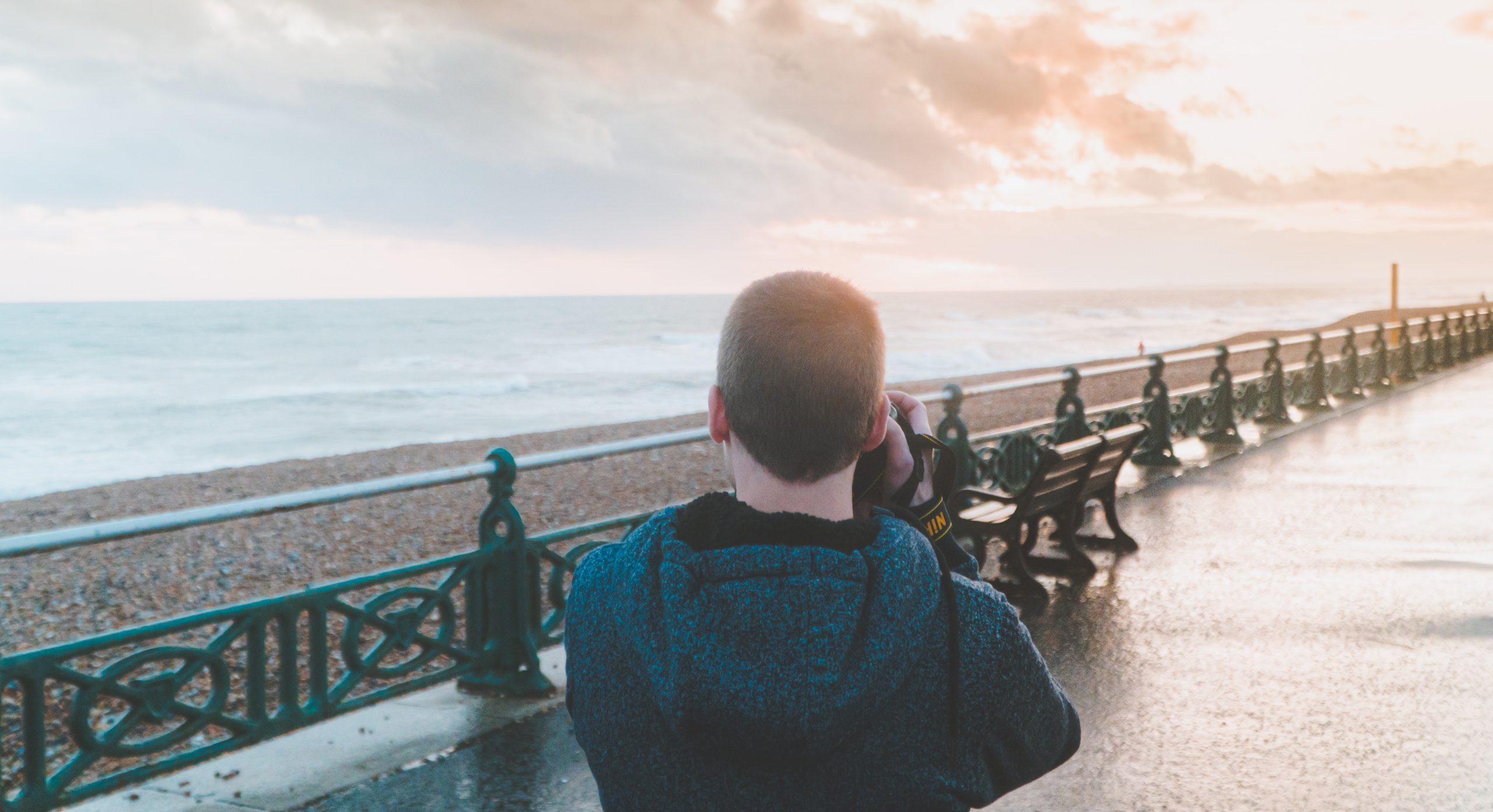 Man Taking Photo Of a Sunset